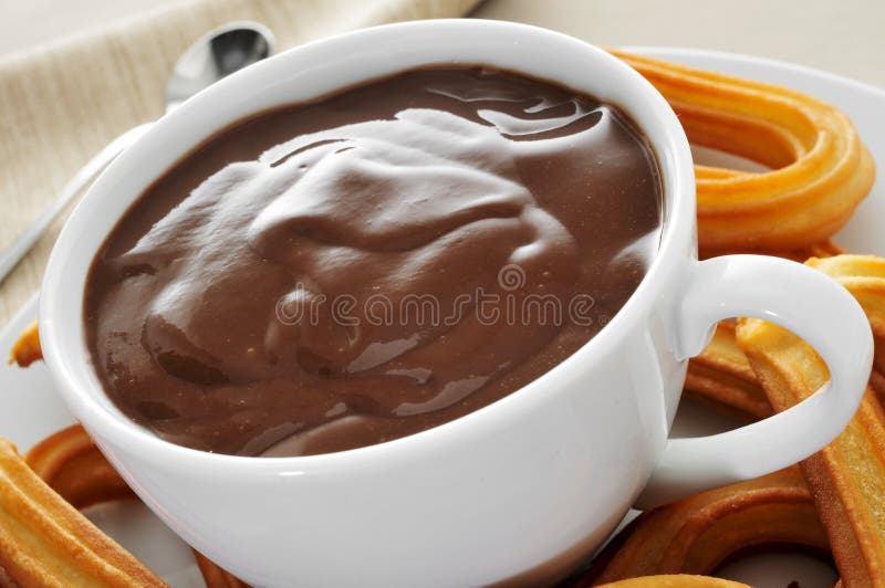 Churros with chocolate stock photo