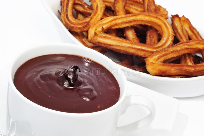 Churros con chocolate typical Spanish sweet snack royalty free stock images