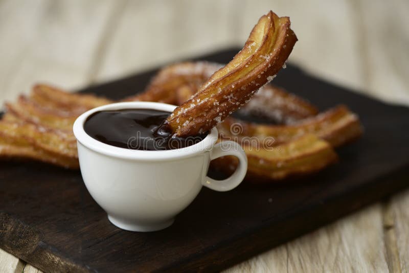 Churros con chocolate, a typical Spanish sweet snack stock photos