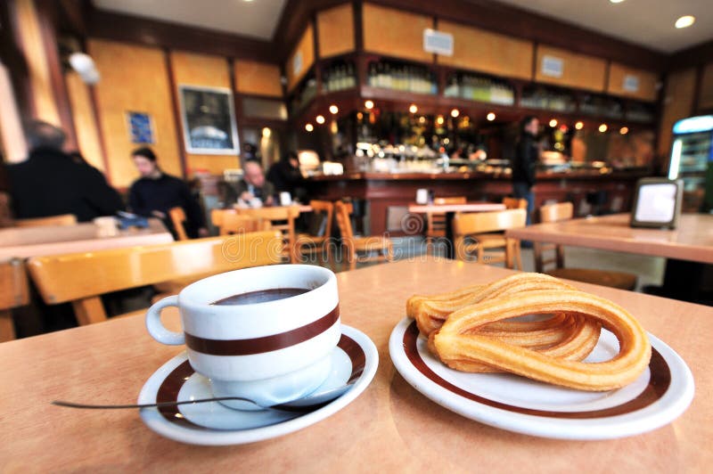 Churros and hot chocolate stock images