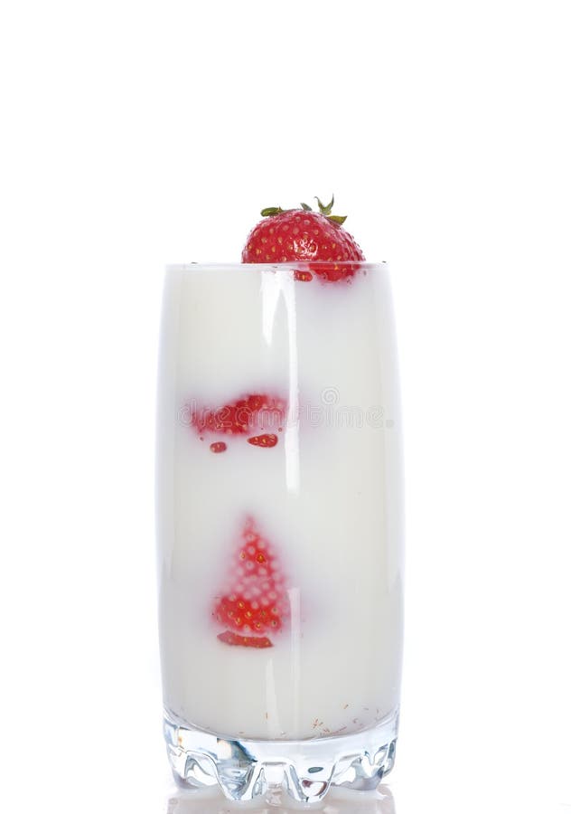 Strawberries falling into cream or milk and splashing. Strawberries falling into cream or milk and splashing