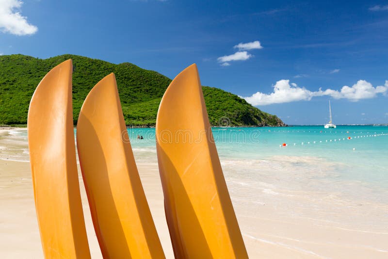 Anse Marcel beach with three yellow kayaks or canoes on french side of St Martin Sint Maarten Caribbean. Anse Marcel beach with three yellow kayaks or canoes on french side of St Martin Sint Maarten Caribbean