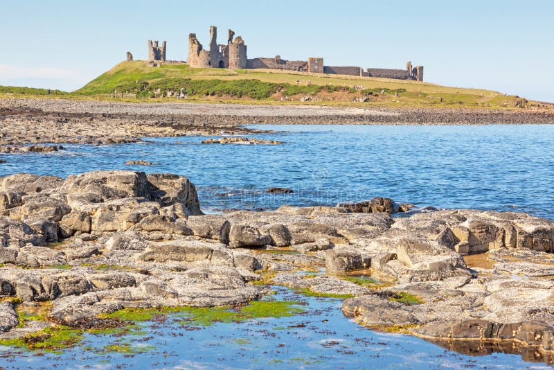 Dunstanburgh Castle, a 14th-century fortification on the coast of Northumberland in northern England, is situated between the villages of Craster and Embleton. Dunstanburgh Castle, a 14th-century fortification on the coast of Northumberland in northern England, is situated between the villages of Craster and Embleton