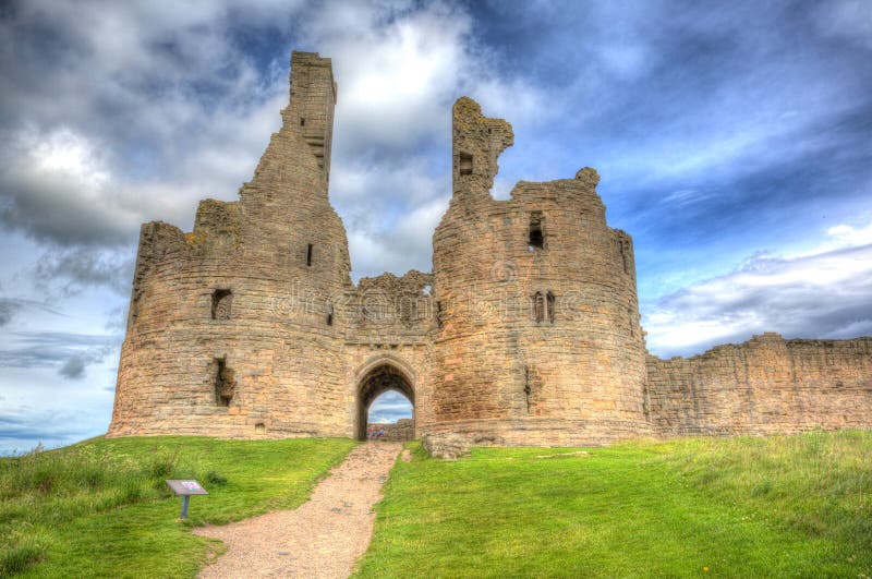 English medieval castle Dunstanburgh Northumberland England uk in colourful hdr. English medieval castle Dunstanburgh Northumberland England uk in colourful hdr