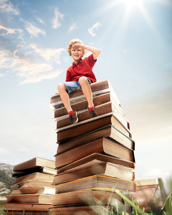 Little boy sitting on the tower made of big books. Childhood dreams, reading and education concept. Wondering world. abstract collage. Little boy sitting on the tower made of big books. Childhood dreams, reading and education concept. Wondering world. abstract collage