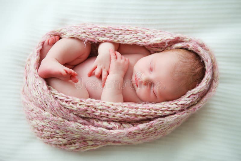 Sleeping newborn baby in a wrap. Sleeping newborn baby in a wrap