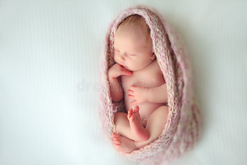 Sleeping newborn baby in a wrap. Sleeping newborn baby in a wrap