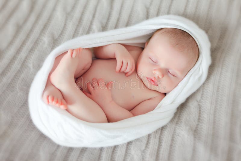 Sleeping newborn baby in a wrap. Sleeping newborn baby in a wrap