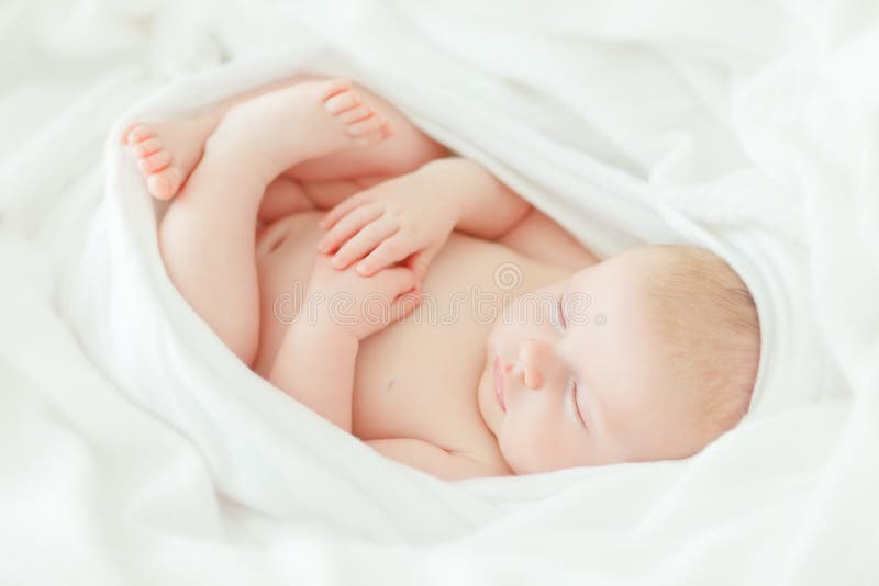 Sleeping newborn baby in bright wrap. Sleeping newborn baby in bright wrap