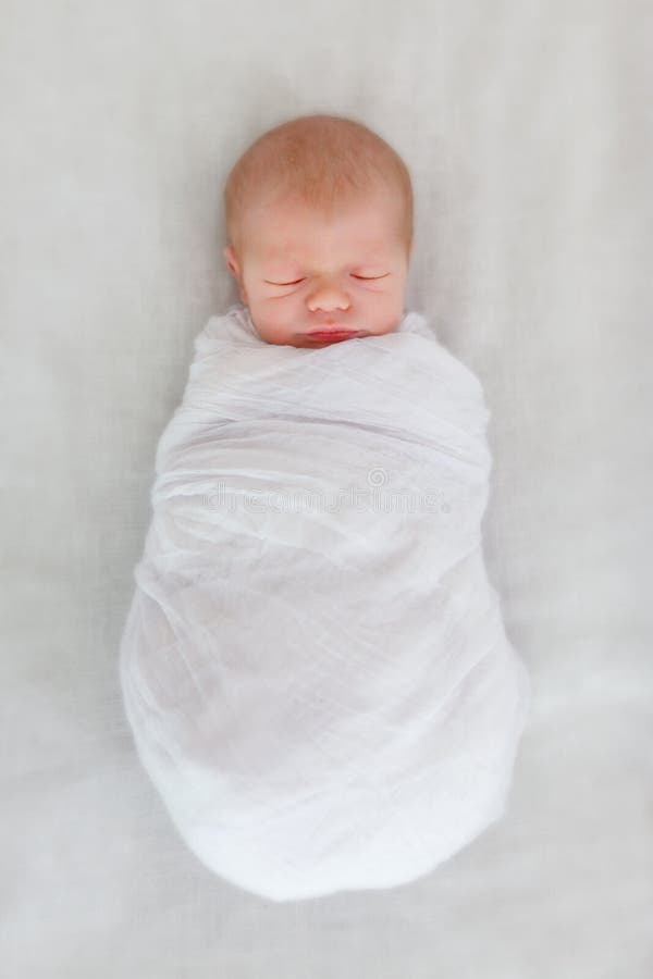 Sleeping newborn baby in a wrap. Sleeping newborn baby in a wrap