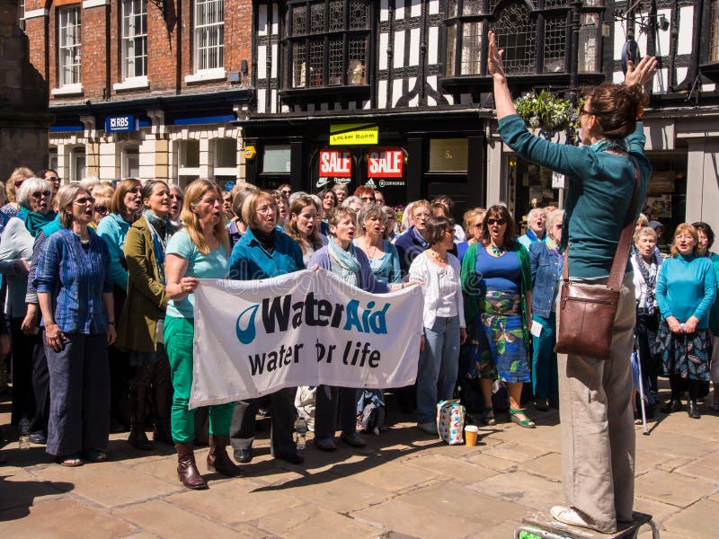 Choir of senior women performing in a town centre to raise funds for the international charity Water Aid. Shrewsbury, Shropshire, England. Choir of senior women performing in a town centre to raise funds for the international charity Water Aid. Shrewsbury, Shropshire, England.