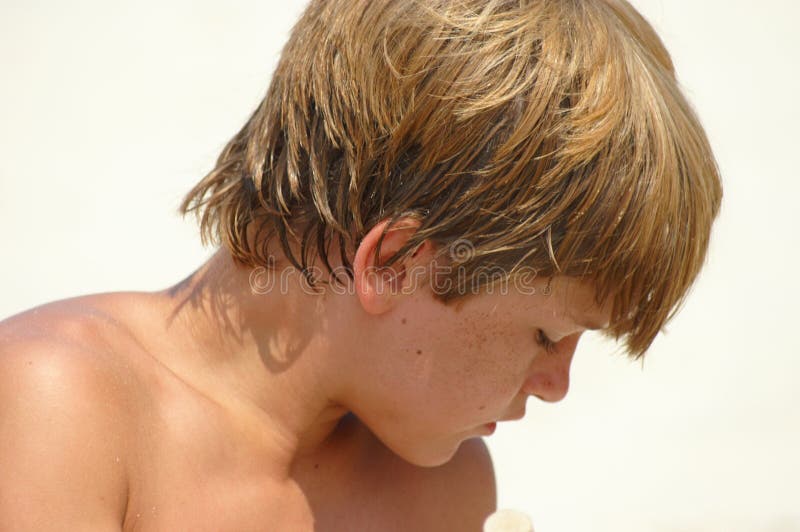 Portrait of young boy looking down. Portrait of young boy looking down