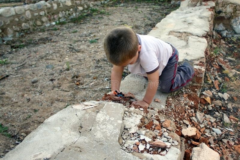 Baby boy playing in the dangerous place. Baby boy playing in the dangerous place