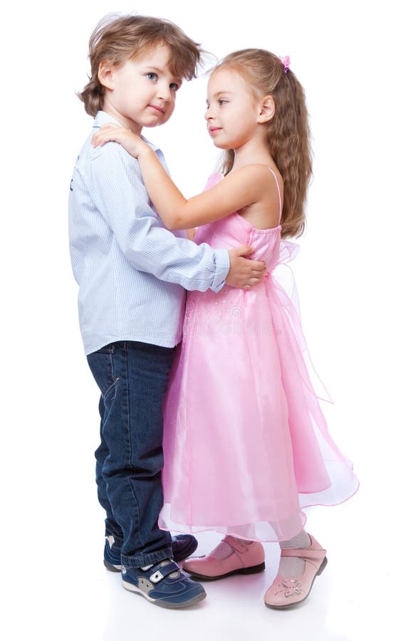 Little boy and girl in love. Isolated on white background. Little boy and girl in love. Isolated on white background