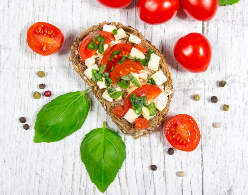 Ciabatta Bread with Tomatoes, Mozzarella and Basil. Stock Image - Image ...