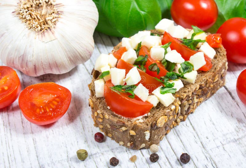 Ciabatta Bread with Tomatoes, Mozzarella and Basil. Stock Photo - Image ...