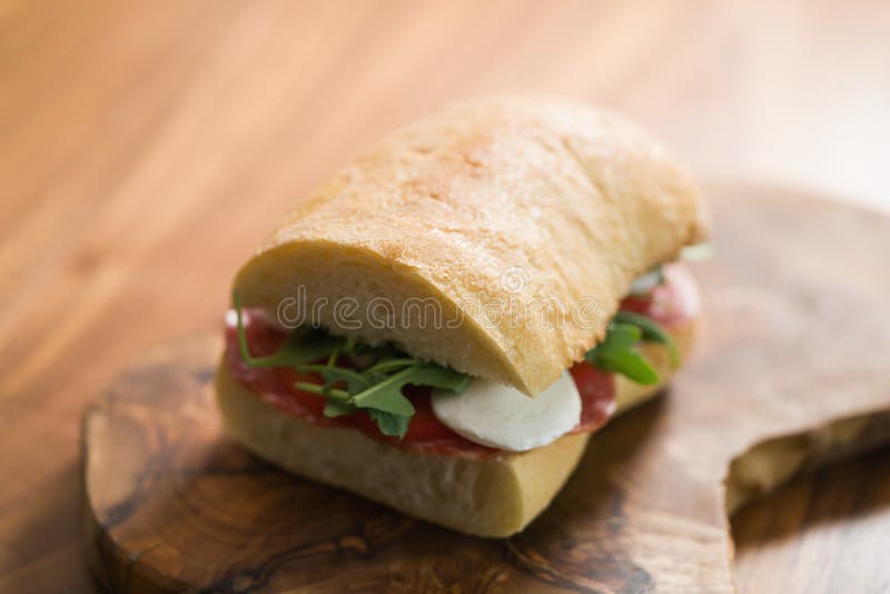 Ciabatta Sandwich with Salami and Mozzarella Cheese on Walnut Table Stock Photo Image of
