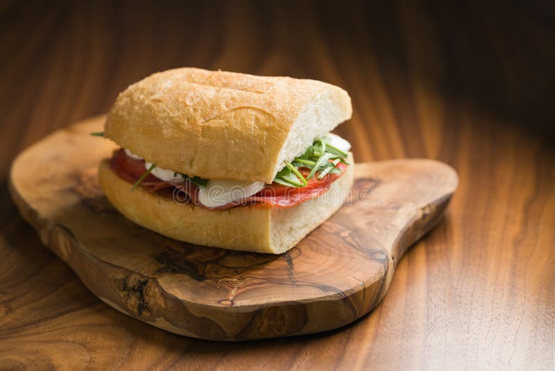 Ciabatta Sandwich with Salami and Mozzarella Cheese on Walnut Table Stock Photo Image of