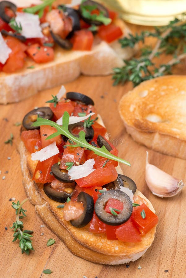 Ciabatta with Tomatoes, Olives, Parmesan Cheese and Herbs Stock Photo ...