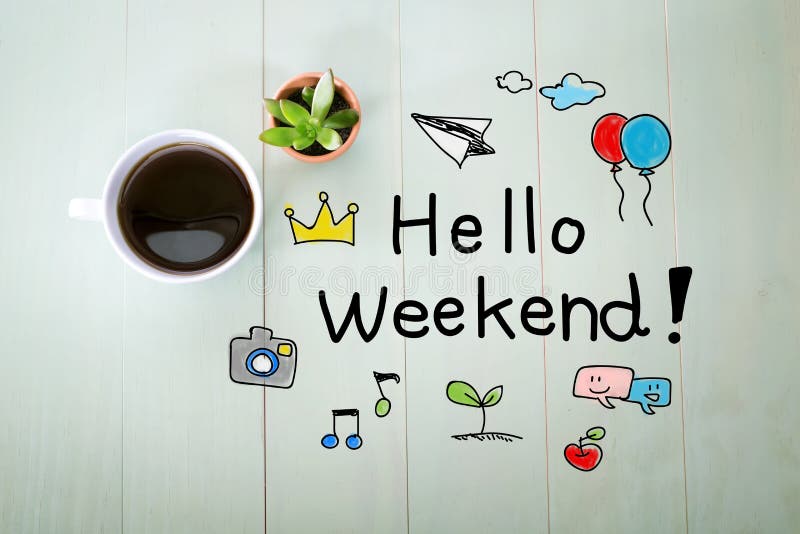 Hello Weekend message with a cup of coffee on a pastel green wooden table. Hello Weekend message with a cup of coffee on a pastel green wooden table