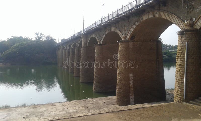 An old bridge on the krishna river in the sangli city which was built in british rule in india by british rulers. An old bridge on the krishna river in the sangli city which was built in british rule in india by british rulers