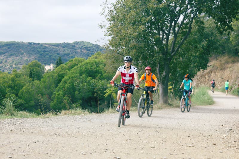 Spain, Barcelona - October 7, 2017: mountain bikers on mount Tibidabo for a walk on a free day. Spain, Barcelona - October 7, 2017: mountain bikers on mount Tibidabo for a walk on a free day