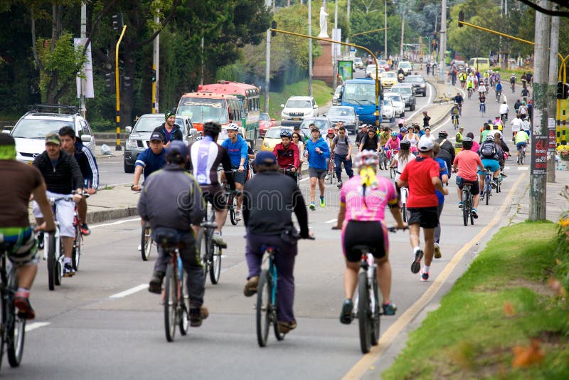 BOGOTA, COLOMBIA - MAY 04, 2014: Pedestrians and cyclists taking part in Ciclovia. Each Sunday and public holiday certain main streets are blocked to cars for runners, skaters, and bicyclists.