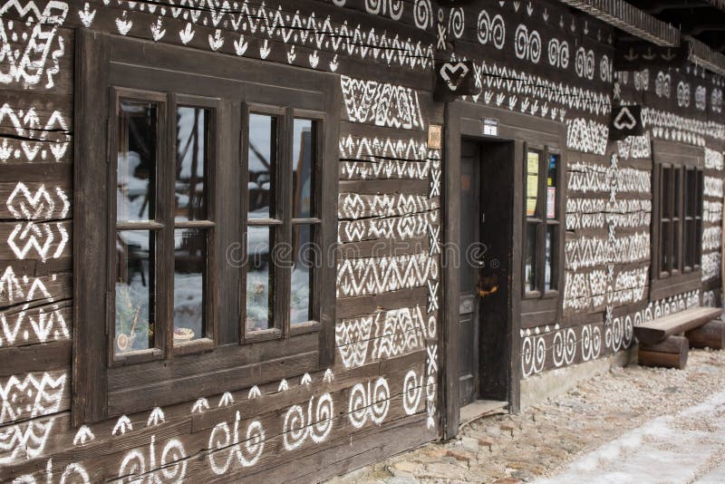 Cicmany, Slovakia. Old wooden houses in Slovakia village Cicmany in winter. The ornaments from Cicmany, and the Slovak folk patter