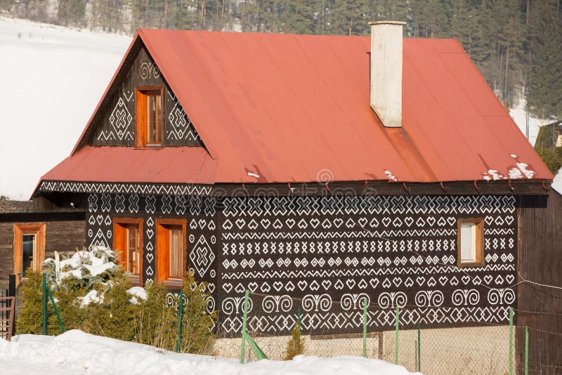 Cicmany, Slovakia. Old wooden houses in Slovakia village Cicmany in winter. The ornaments from Cicmany, and the Slovak folk patter