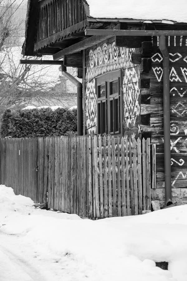 Cicmany, Slovakia. Old wooden houses in Slovakia village Cicmany in winter. The ornaments from Cicmany, and the Slovak folk patter