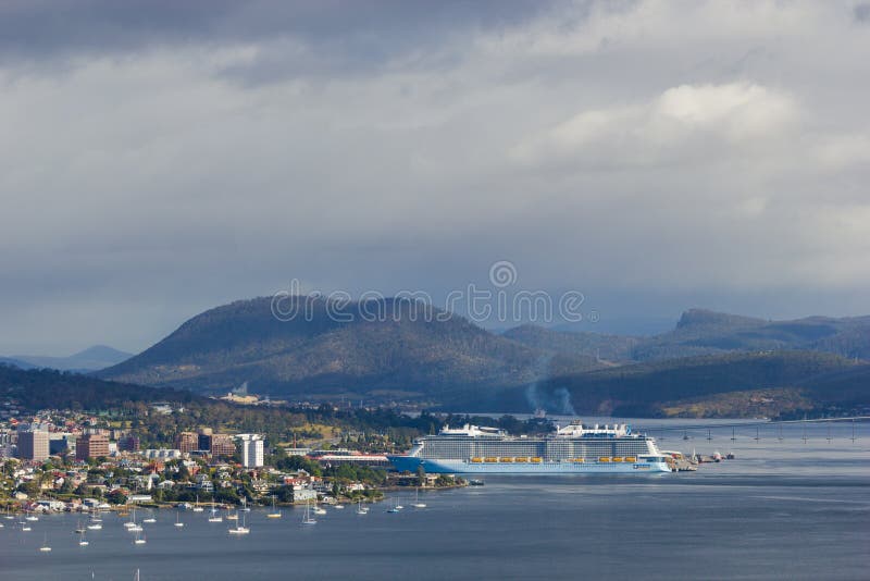 Hobart, Tasmania, Australia - 17 December 2017: Derwent estuary with cruise ship docking in Hobart harbour. Hobart, Tasmania, Australia - 17 December 2017: Derwent estuary with cruise ship docking in Hobart harbour