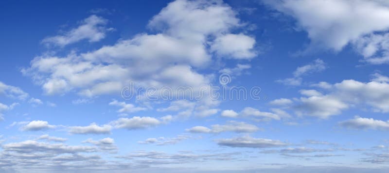 Blue sky with clouds. Panoramic backdrop. Early afternoon light. Sky all the way to the horizon. Blue sky with clouds. Panoramic backdrop. Early afternoon light. Sky all the way to the horizon.
