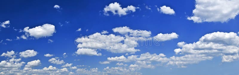 Panoramic background of blue sky with white cumulus clouds. Panoramic background of blue sky with white cumulus clouds