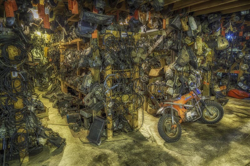 A hoarder's collection of motorcycle parts, acquired over a lifetime and taking up an entire barn with hardly any space to walk. A hoarder's collection of motorcycle parts, acquired over a lifetime and taking up an entire barn with hardly any space to walk