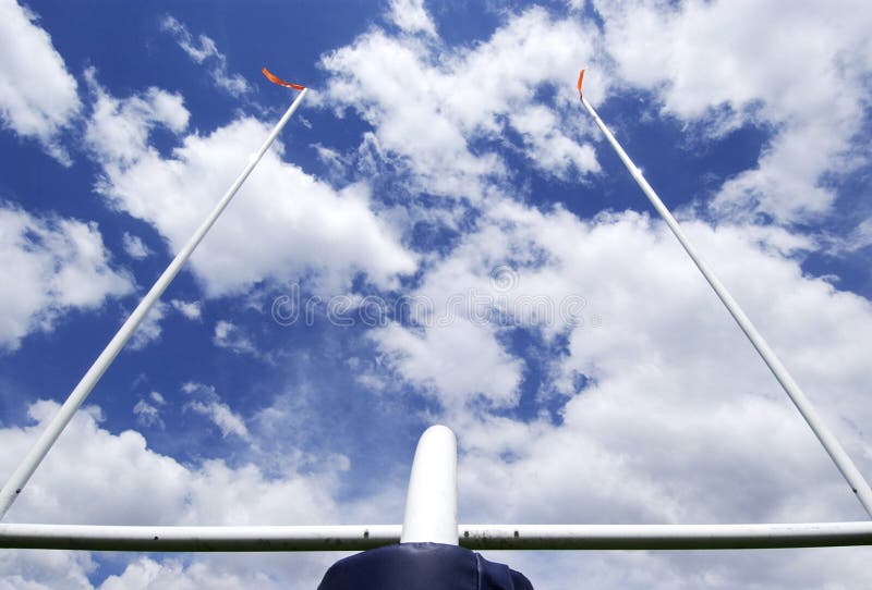 Football field goal post with blue sky backdrop. Football field goal post with blue sky backdrop