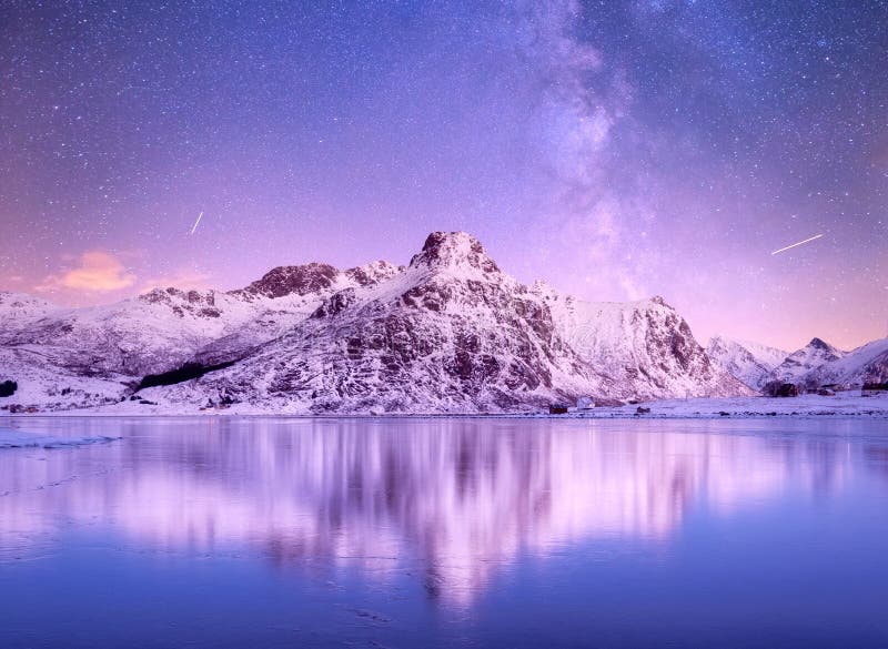 Night sky and reflection on the frozen lake. Natural landscape in the Norway. Night sky and reflection on the frozen lake. Natural landscape in the Norway