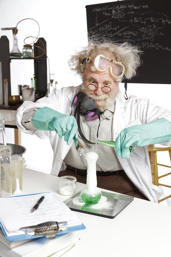 Amazed mad senior scientist in lab reacts to foaming green liquid overflowing beaker. Frizzy grey hair, round glasses, lab coat, aqua rubber gloves, blank blackboard, vertical, high key, copy space. Amazed mad senior scientist in lab reacts to foaming green liquid overflowing beaker. Frizzy grey hair, round glasses, lab coat, aqua rubber gloves, blank blackboard, vertical, high key, copy space.