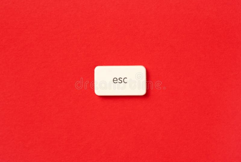 Close-up of an Escape symbol button on a vibrant red background, symbolizing the idea of leaving everything behind and starting anew. The button stands out, creating a strong visual impact. Close-up of an Escape symbol button on a vibrant red background, symbolizing the idea of leaving everything behind and starting anew. The button stands out, creating a strong visual impact