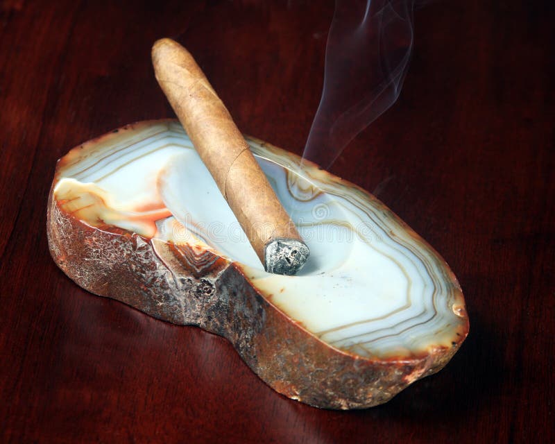 Cigar in an ashtray stock photo. Image of rolled, focus 15422380