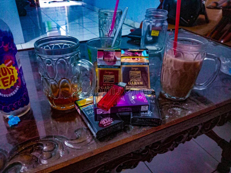 Cigarettes and juice on the table. Cigarettes and juice on the table