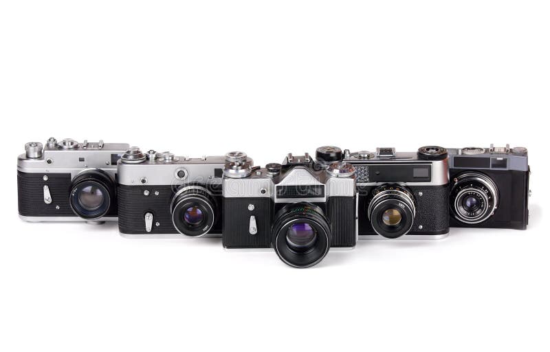 Row of five 35mm photo cameras on white background. Row of five 35mm photo cameras on white background