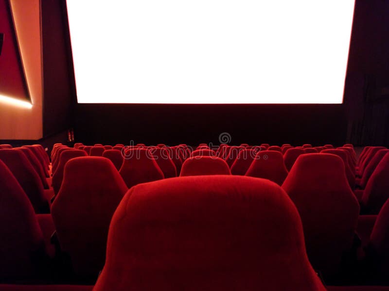 Cinema - interior of a movie theatre with empty red and black seats with white screen - mock-up screen royalty free stock images Cinema - interior of a movie theatre with empty red and black seats with white screen - mock-up screen royalty free stock images