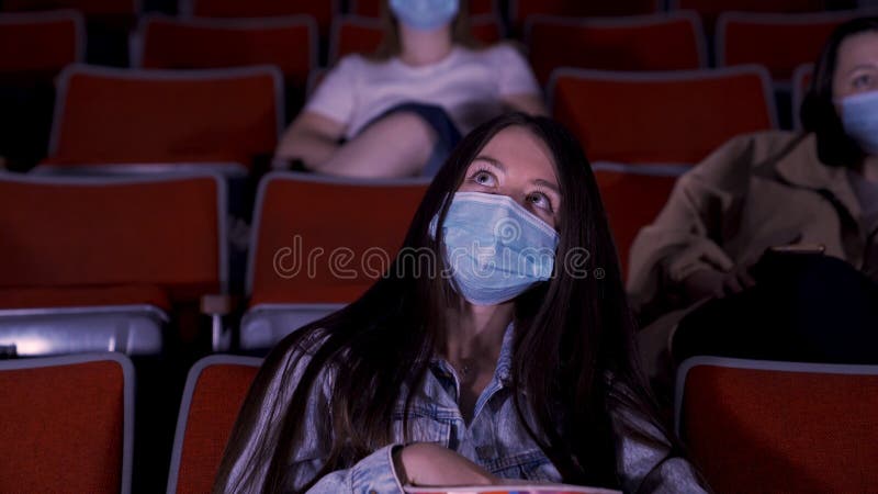 Cinema in quarantine, coronavirus pandemic safety rules, social distance during movie watching. Media. Beautiful long