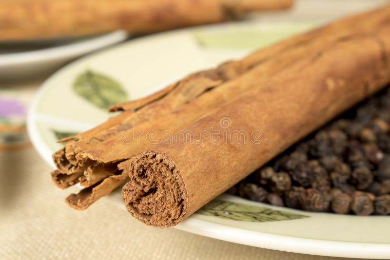 Cinnamon and Black Pepper on Decorated Dish Stock Photo Image of