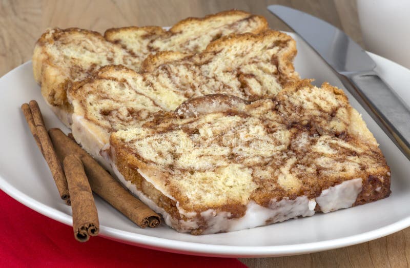 Cinnamon Bread Pudding Breakfast Casserole with Vanilla Sauce Stock
