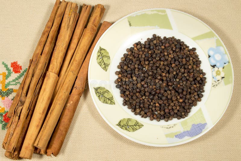 Cinnamon and Black Pepper on Decorated Dish Stock Photo Image of