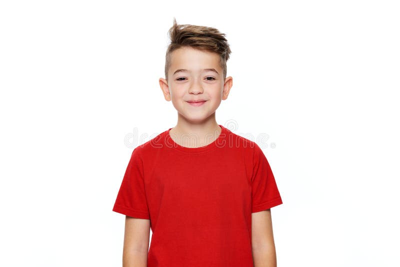 Adorable young teenage boy waist up studio portrait isolated over white background. Handsome boy looking at camera with cheeky smile. Adorable young teenage boy waist up studio portrait isolated over white background. Handsome boy looking at camera with cheeky smile