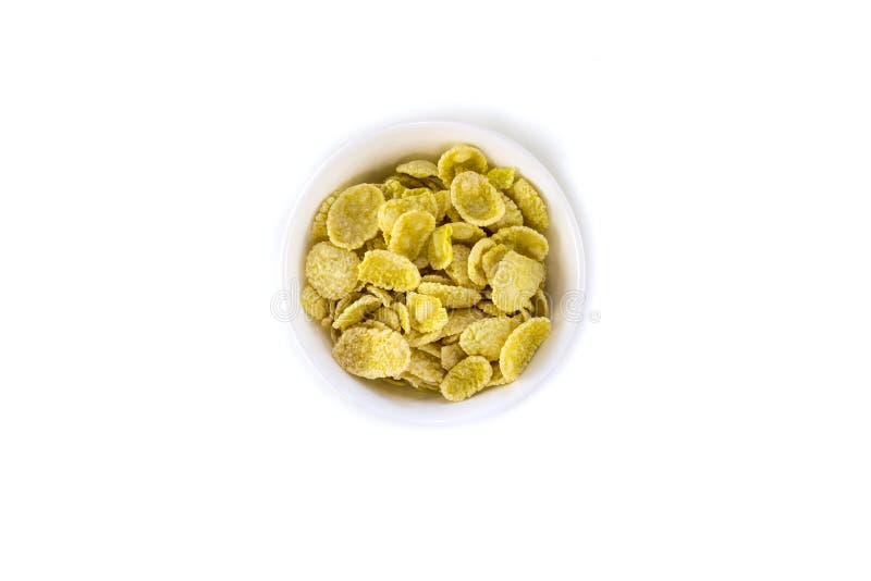 Ciotola di fiocchi di mais con isolato su fondo bianco immagine stock Ciotola di fiocchi di mais con isolato su fondo bianco immagine stock