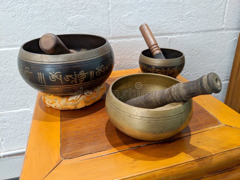 Honolulu - March 19, 2019:  Sound bowls on display inside Hikina Yoga Studio in Honolulu, Hawaii, oahu, kapalama, sign, exercise, meditation, hot, grace, lounge, exterior, business, relaxation, healthy, outdoors, body, outside, activity, fitness, peace, wellness, company, commercial, wellbeing, relaxing, workout, spiritual, train, meditating, signage, enlightenment, salvation, healthiness, mantra, external, entrance. Honolulu - March 19, 2019:  Sound bowls on display inside Hikina Yoga Studio in Honolulu, Hawaii, oahu, kapalama, sign, exercise, meditation, hot, grace, lounge, exterior, business, relaxation, healthy, outdoors, body, outside, activity, fitness, peace, wellness, company, commercial, wellbeing, relaxing, workout, spiritual, train, meditating, signage, enlightenment, salvation, healthiness, mantra, external, entrance