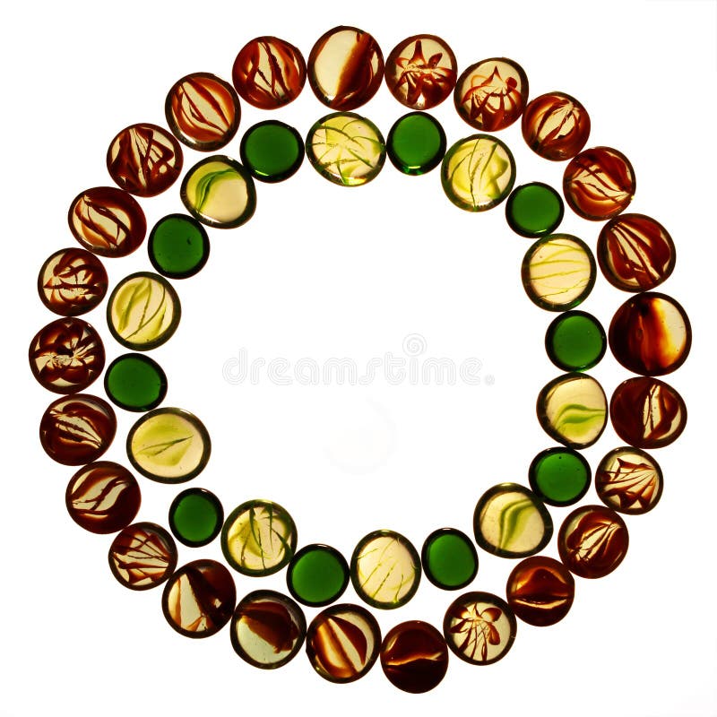 Circle pattern of colorful transparent glass marbles isolated on stock photos